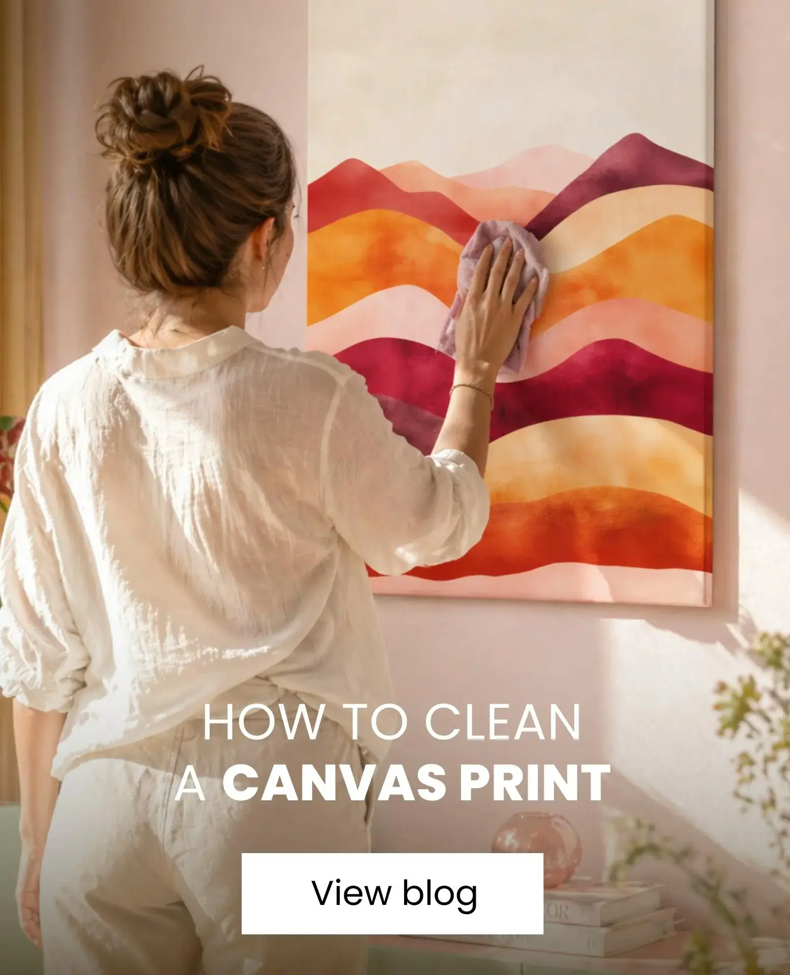 woman cleaning her canvas hanging on the wall